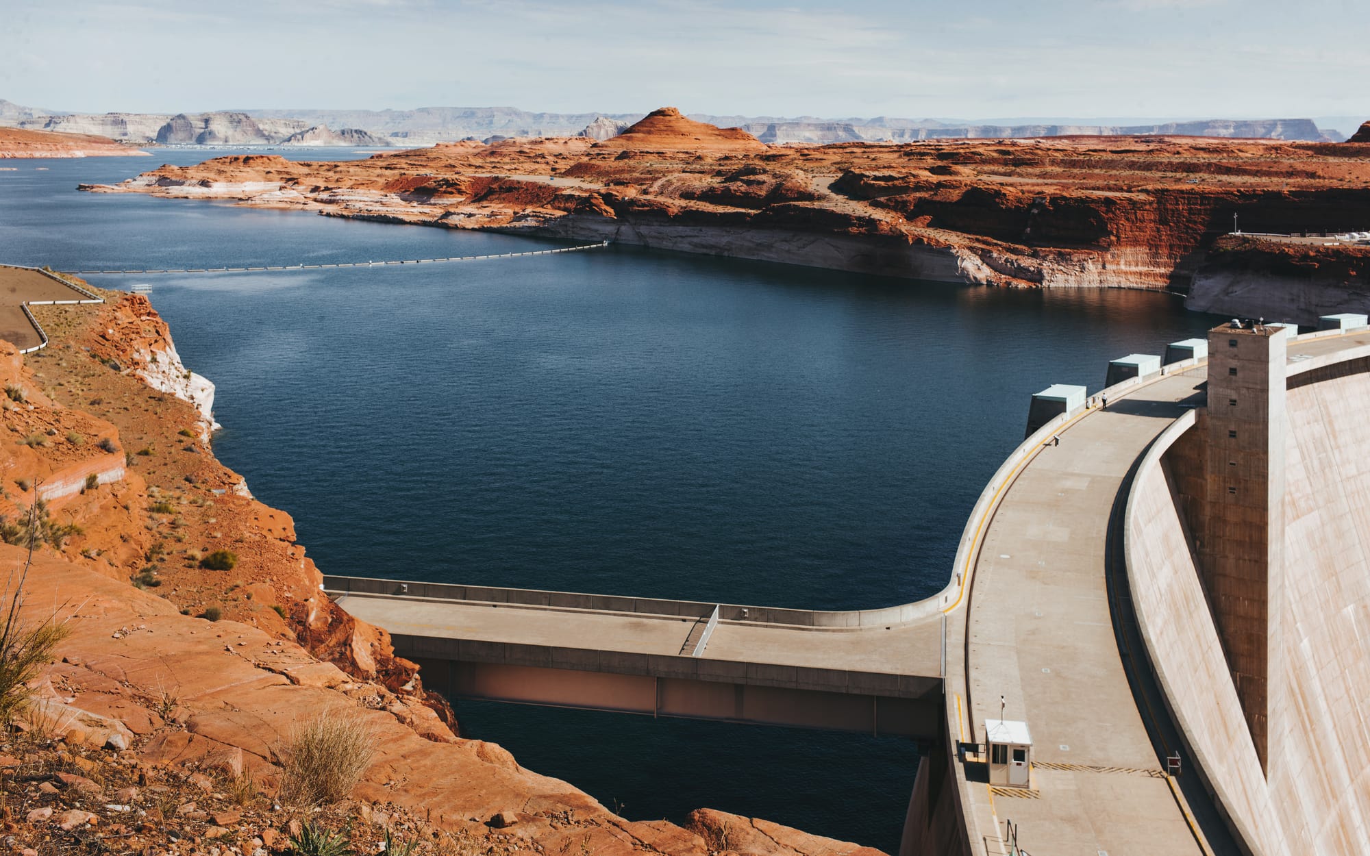 Concrete arch dam and reservoir in a river canyon