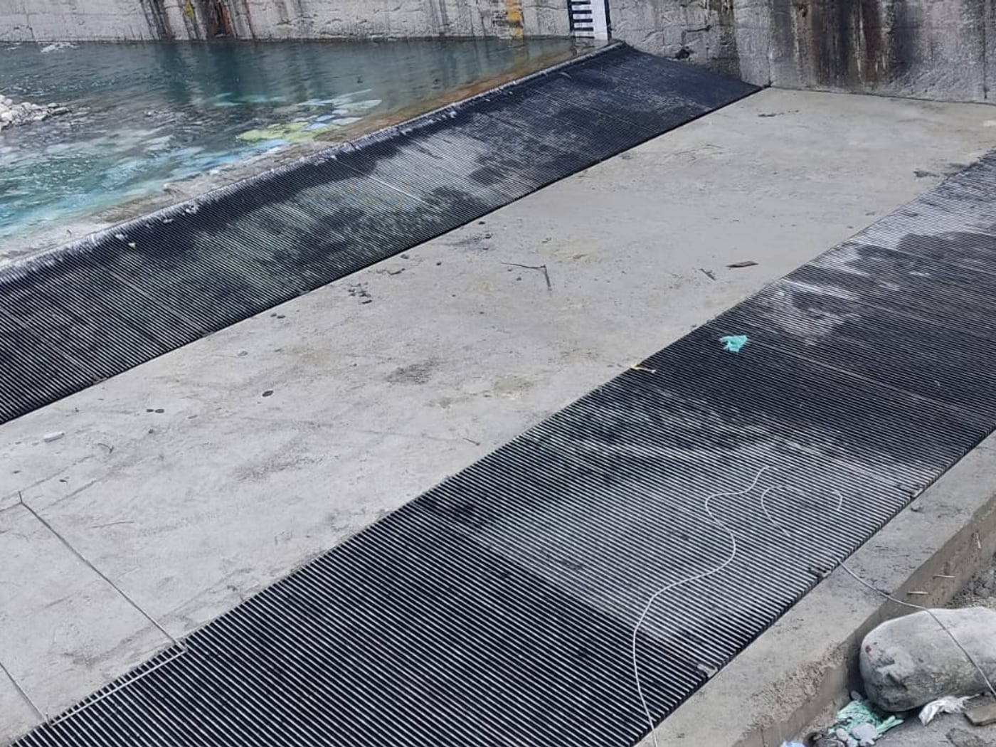 Rebuilt trench weir apron with new screen panels and restored water flow at Bhaledh