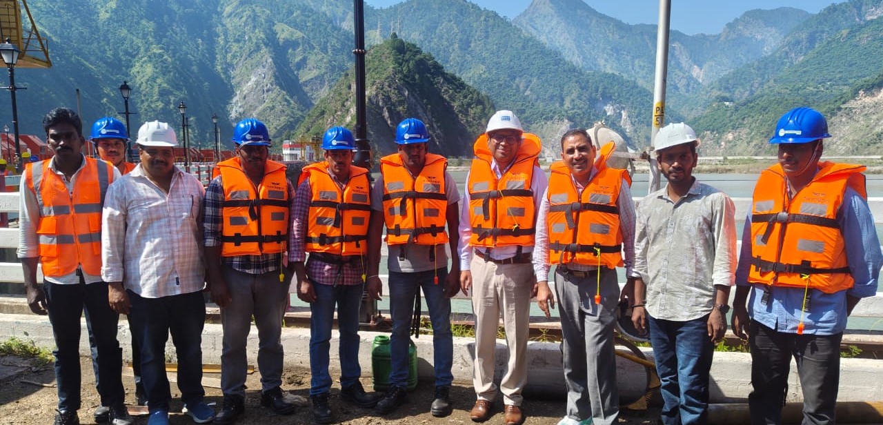 Basmni engineering team on-site at a hydropower reservoir installation